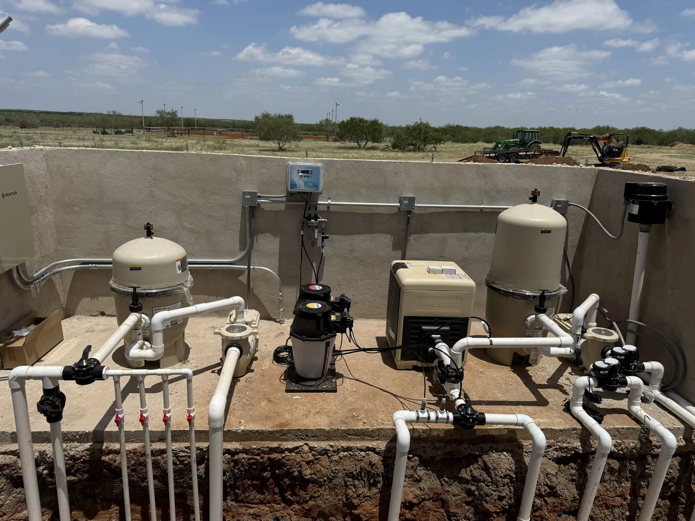 JCW Pools equipment pad with twin cartridge filters, pumps, valves and new PVC plumbing